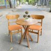 Bộ bàn ghế cafe gỗ nệm màu cam mới 98%